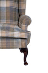 acanthus leg and scroll arm on a wingchair with tartan fabric 