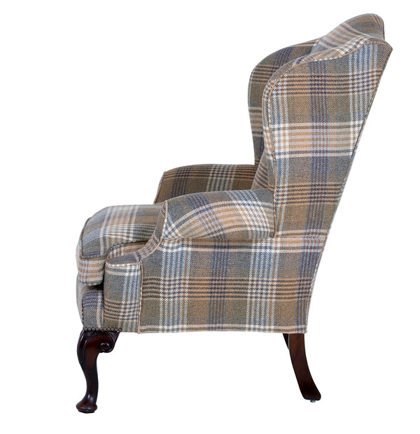 acanthus leg on a hand upholstered wingchair 