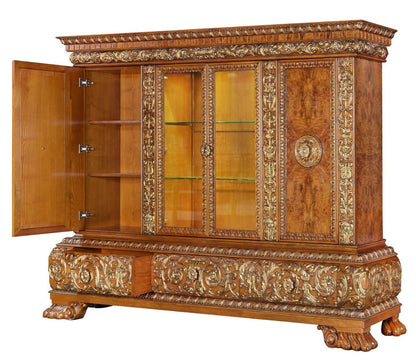 Decorative wooden cabinet with intricate carvings on a white background
