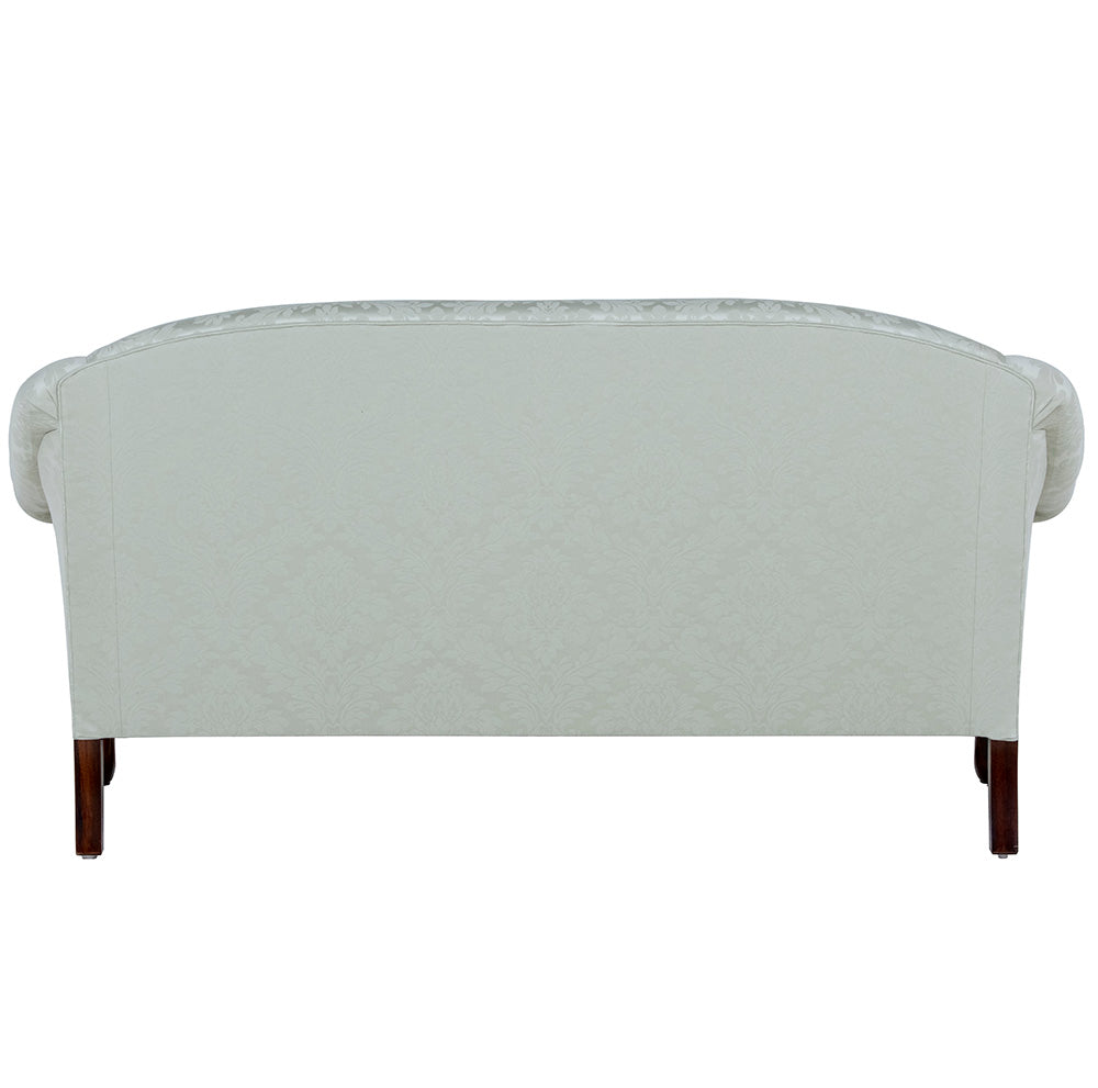 the back of olive green sofa
