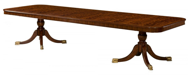 Mahogany extending dining table with self storing leaves