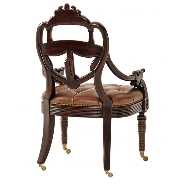 Hand carved mahogany library armchair