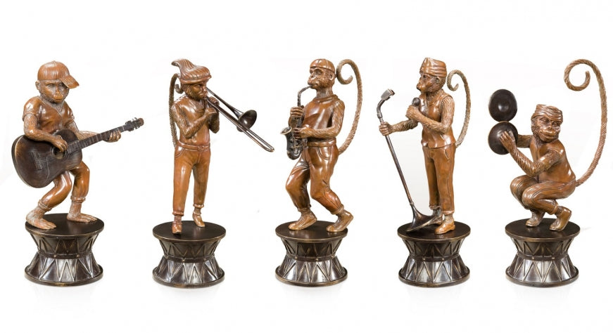 Antiqued brass figures of a band of monkeys