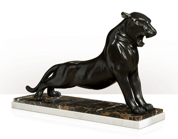 brass sculpture of a roaring panther