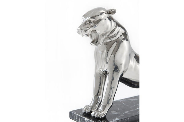 stainless steel sculpture of a roaring panther