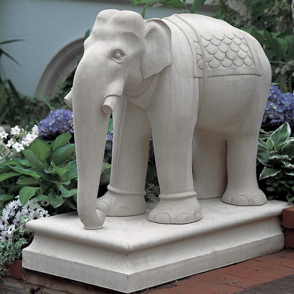Stone elephant statue on base