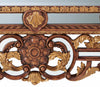 A carved wood and parcel gilt mirror