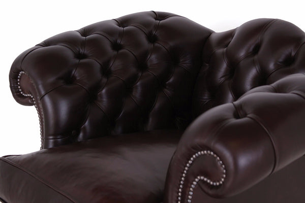 buttoned back leather arm chair