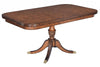 Single pedestal extending dining table in burr oak