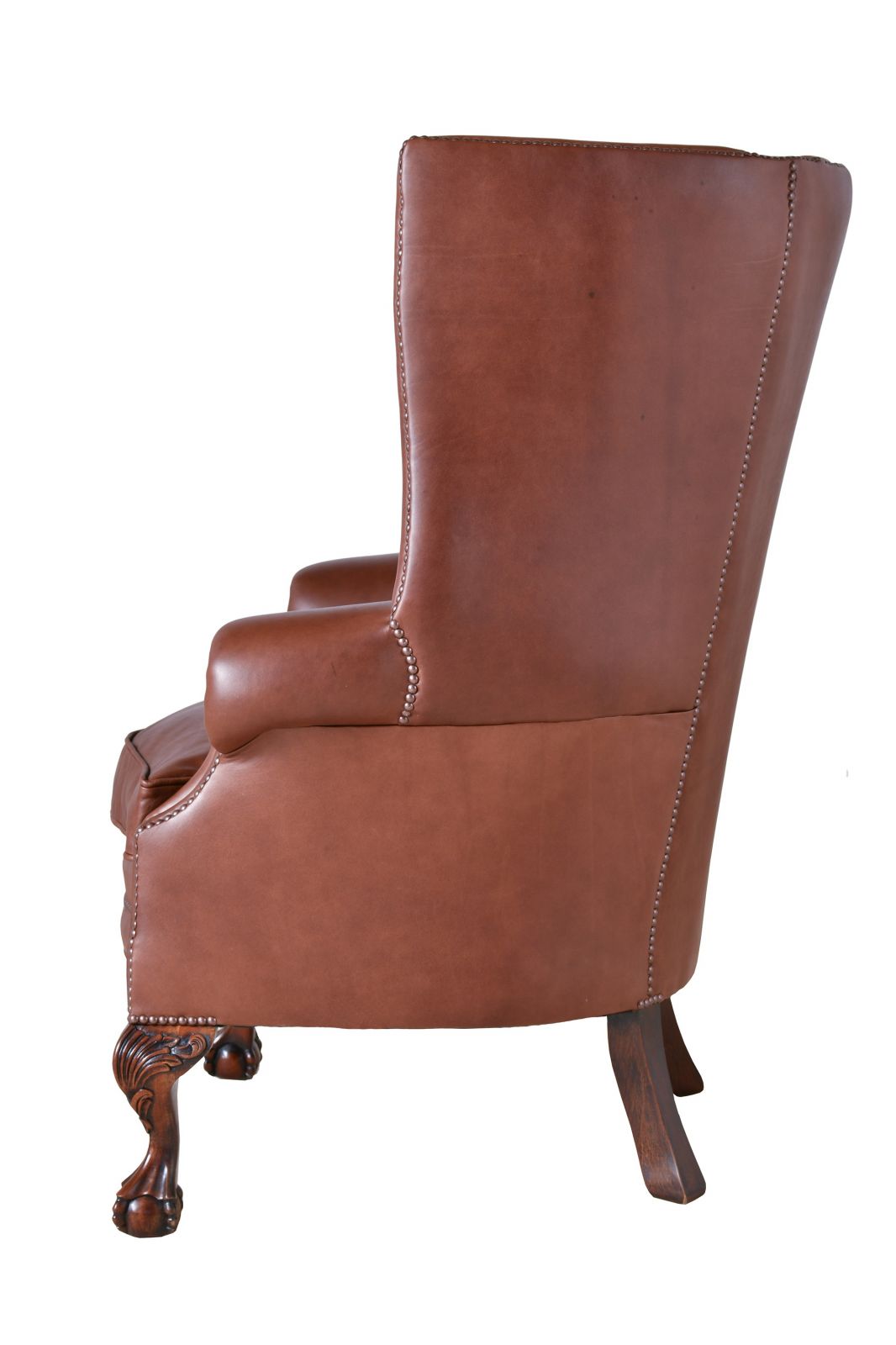 leather and nailed antique wingchair inspired by